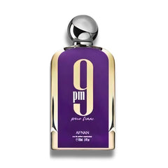 Frasco de AFNAN 9 PM Pour Femme Eau de Parfum 100 ml – Diseño elegante en púrpura con una tapa plateada brillante, destacando el logotipo '9 PM' en el centro del frasco. Esta presentación sofisticada refleja la esencia moderna y lujosa del perfume.