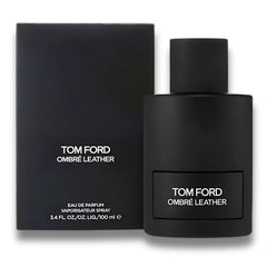 Frasco y estuche de Tom Ford Ombre Leather Eau de Parfum 100 ml – El frasco negro con detalles minimalistas se presenta junto a un estuche igualmente elegante y sobrio, resaltando el logotipo de Tom Ford. Esta combinación de lujo muestra la exclusividad del perfume